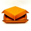 Picture of Collection Arthur - Orange Leather Valet Tray With Eyelets - Size Medium -  18,00cm x  18,00cm x  4,50cm - Weight : 200 Gr - Gordon & Gaia